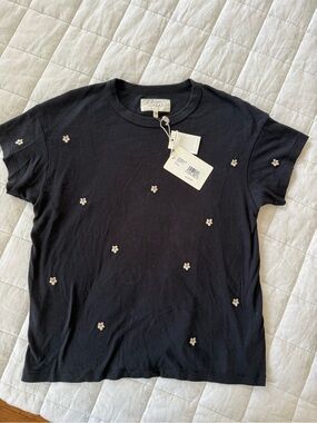 THE GREAT. Black Short Sleeve Tee with Small White Daisy Embroidery
